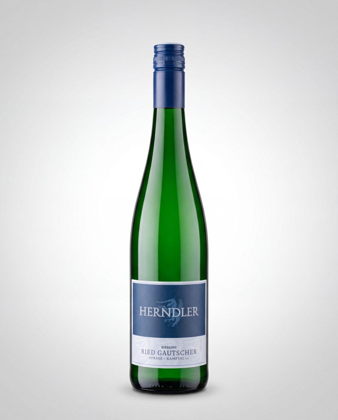 Riesling Ried Gautscher Weingut Herndler - Weingut Herndler Shop Tall green wine bottle with a blue label reading HERNDLER, standing upright against a light gradient background.